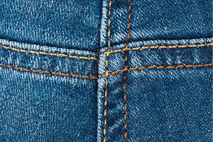 Blue denim fabric close up showing