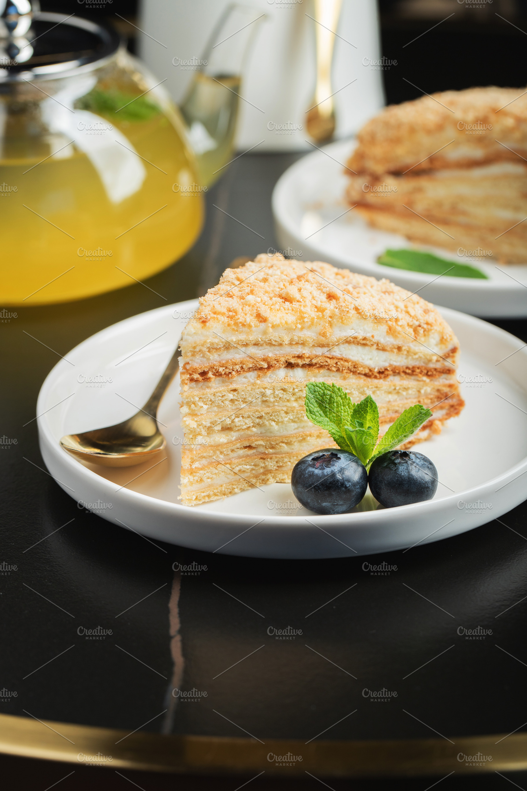 Medovik. Honey cake made from honey cakes with whipped sour cream, decorated wi, a Food & Drink Photo by Budarinphoto