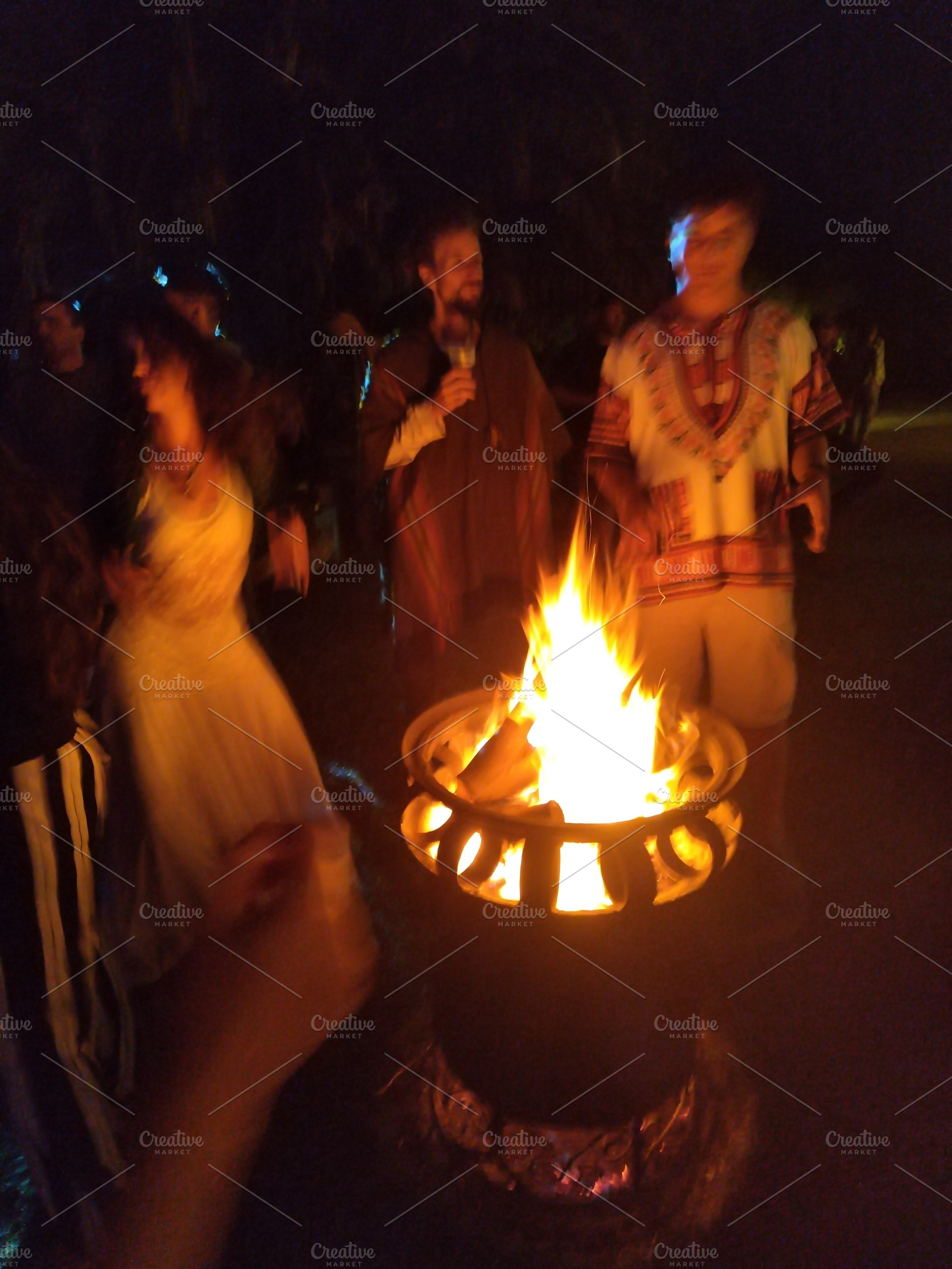 Night campfire gathering with warm storytelling atmosphere, a Person Photo by DanFLCreativo