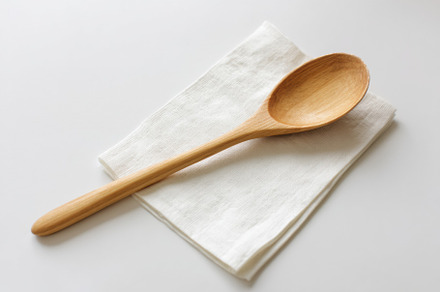 Wooden spoon on white napkin, a Food & Drink Photo by Virgo Studio