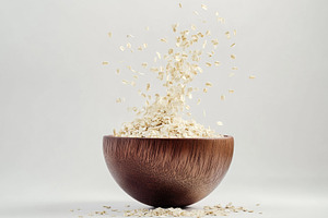 Natural oats cascading from a wooden, a Photo by Tanuart