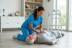 Nurse assisting elderly man fallen o, a Photo by Pixeness Studio