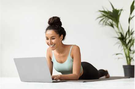 Smiling Young Woman In Sportswear, a Sports & Recreation Photo by Prostock-Studio
