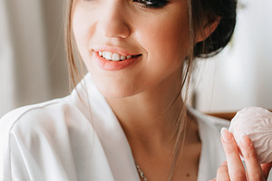 A young bride sits at a slot machine in the morning and drinks c