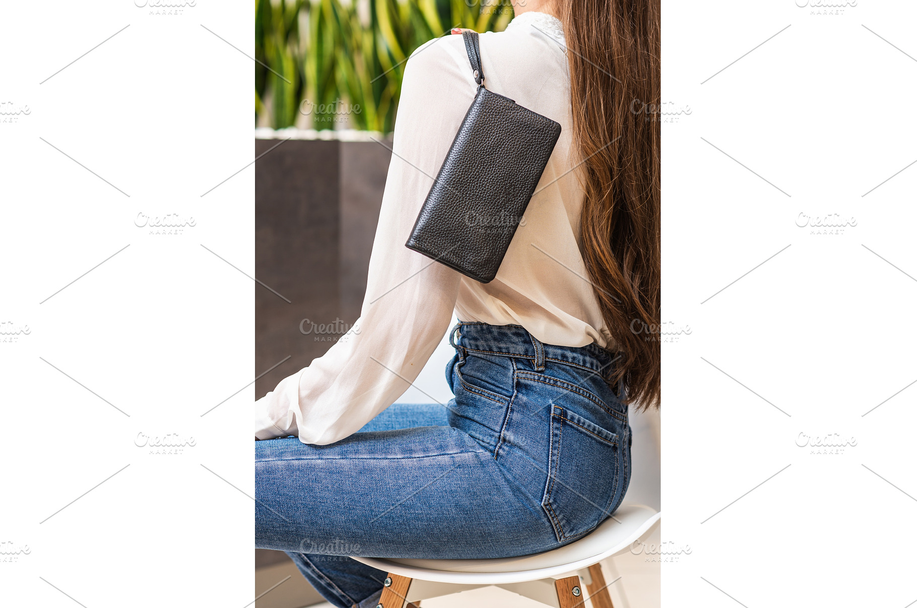 Girl holds dark purse over her, a Person Photo by wip3out