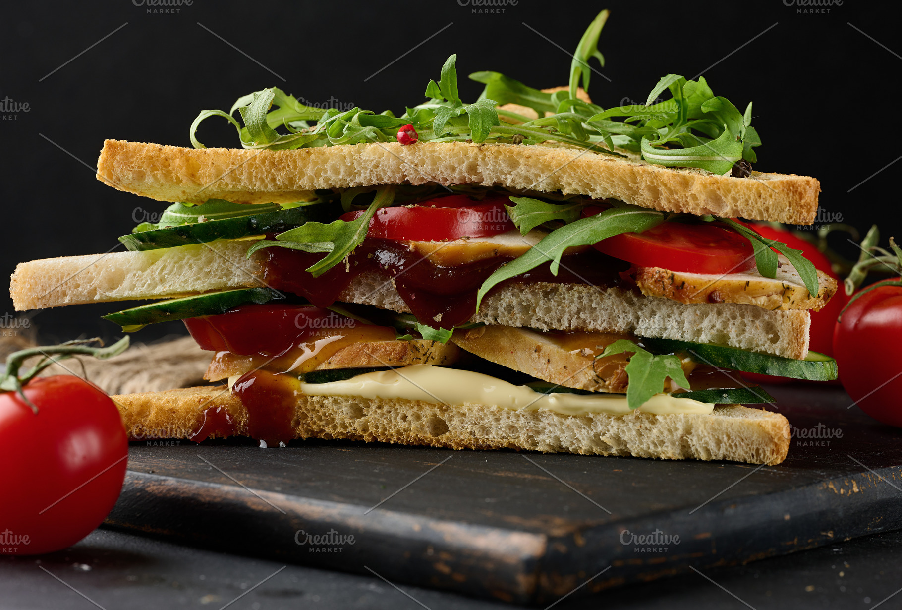 A delicious multi-layered sandwich with grilled chicken, fresh t, a Food & Drink Photo by ndanko