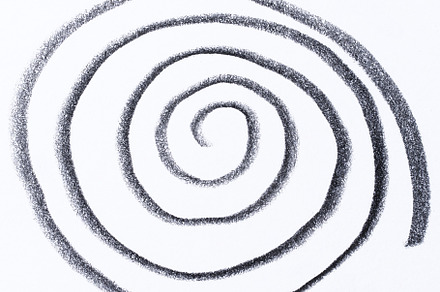 A hand drawn black spiral on a white background. The spiral has