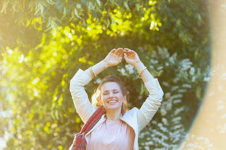 smiling elegant 40 years old woman in dress and jacket in city, a Person Photo by Alliance Images