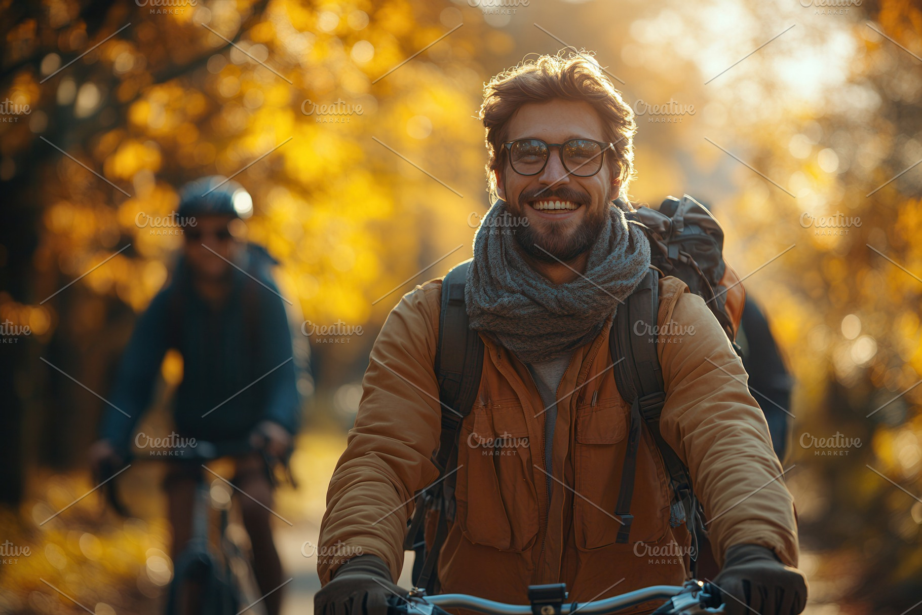 Smiling man riding bicycle in autumn, a Photo by Tanuart