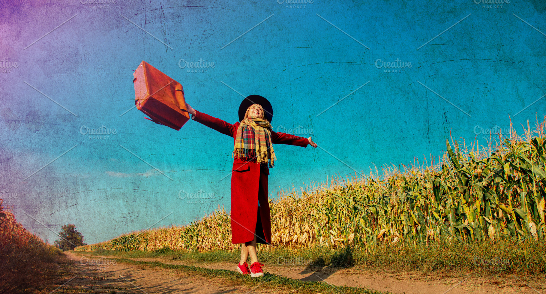 girl coat with suitcase on a rural road near cornfield, a Person Photo by Masson Simon
