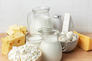 Various dairy products on a wooden table, healthy food concept, a Food & Drink Photo by Olena Rudo