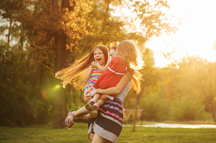 Mother and two daughters hugging, a Person Photo by Elena Vagengeim