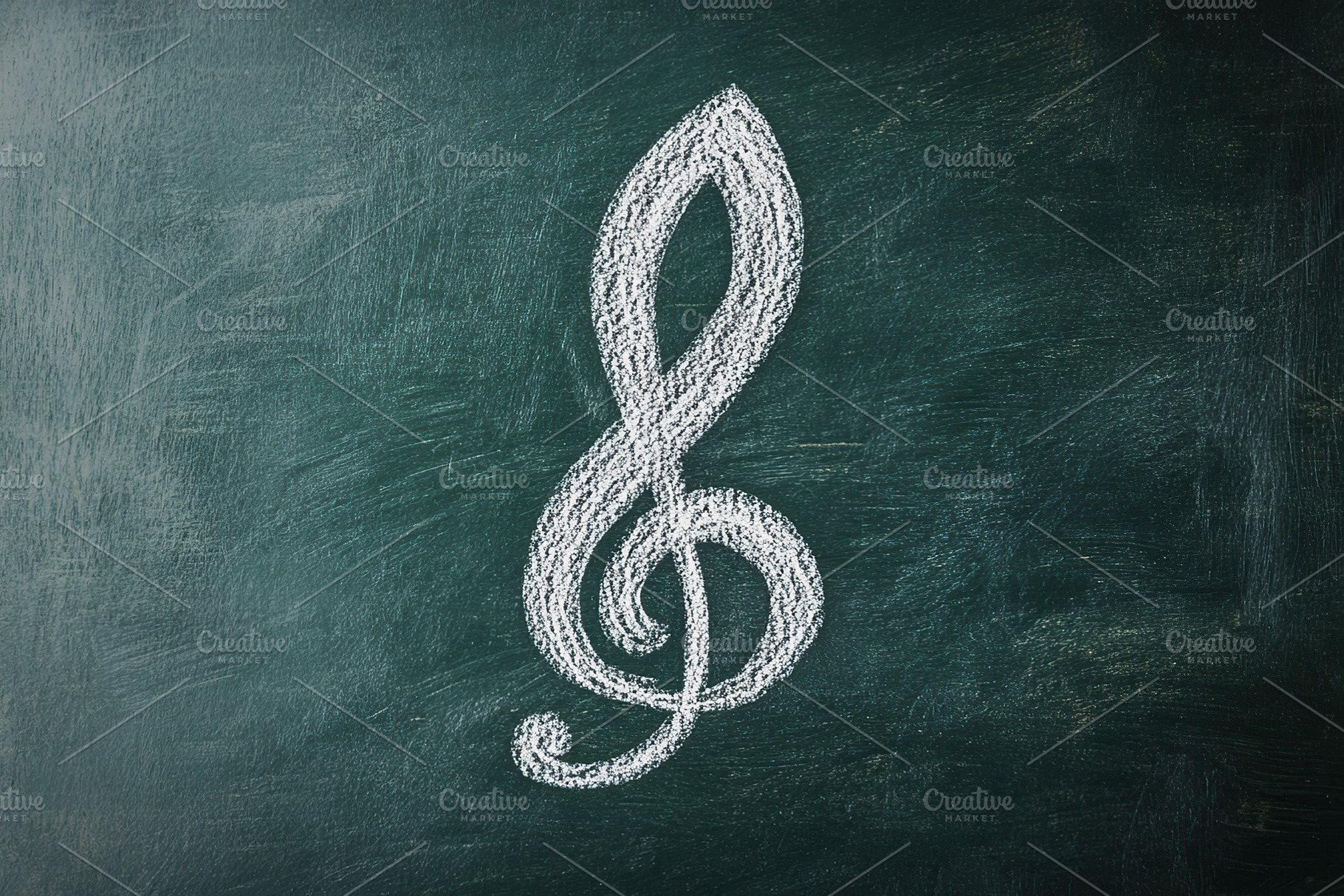 Music treble clef on green background, a Photo by AlyaAnd