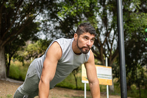 Young man doing push-ups workout in park outdoors, a Sports & Recreation Photo by etorres69