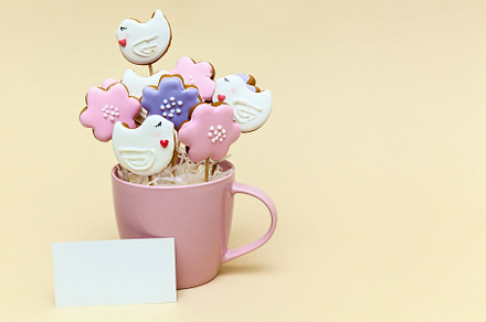 Mug with cookies on a beige background, a Food & Drink Photo by Photostock