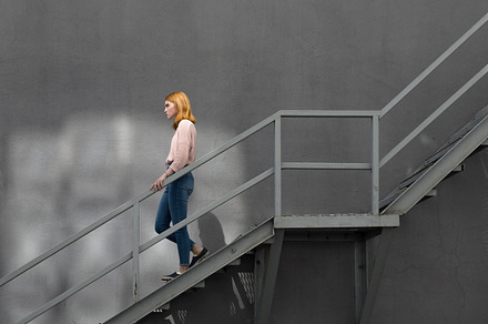 Redhaired girl down the stairs stock photo containing girl and woman, a Person Photo by Aleksandr Korotun Photo