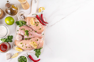 Fresh raw organic chicken breast fillet, with spices and condime, a Food & Drink Photo by Rimma