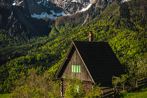 Lonely cute wooden hut on the slope, an Architecture Photo by Alpine Dreams