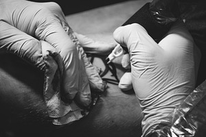 Tattoo Artist at Work Black White.1