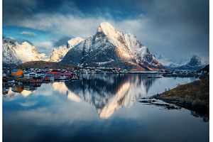 Snowy mountains reflect in fjord, a Nature Photo by den-belitsky