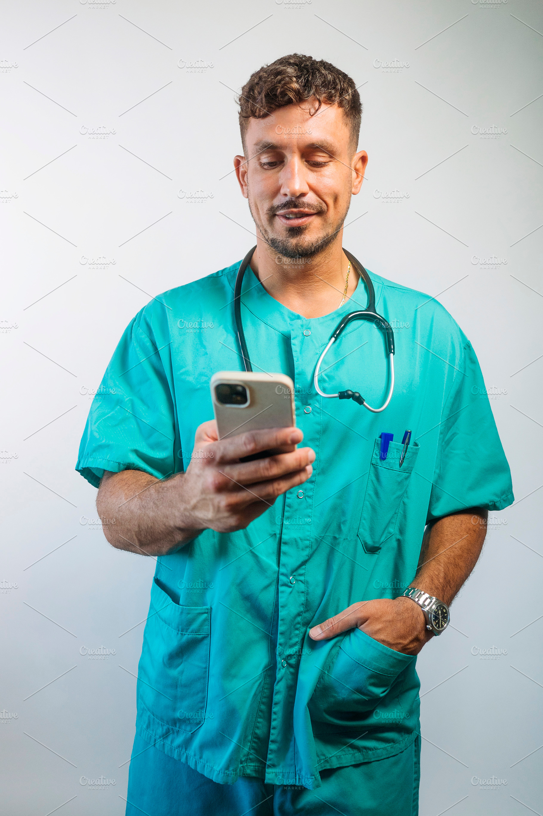 Healthcare Worker Checking a Smartphone, a Person Photo by karrastock