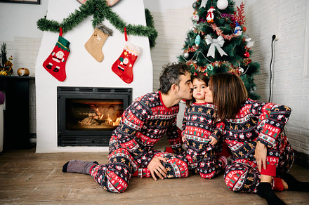 Family wearing matching Christmas pajamas, a Holiday Photo by YossSabalet