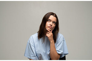 Young woman thinking deeply, looking