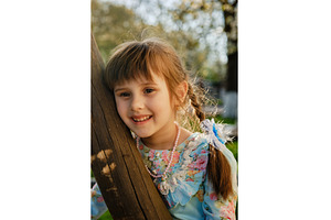 A charming child girl smiles while, a Person Photo by Rohan Photography