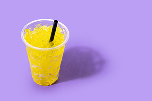 Yellow Slush Drink in Plastic Cup with Black Straw, a Food & Drink Photo by etorres69