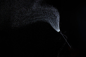 Stream of fine droplets of water escaping from a hose in complet, a Background Photo by ndanko