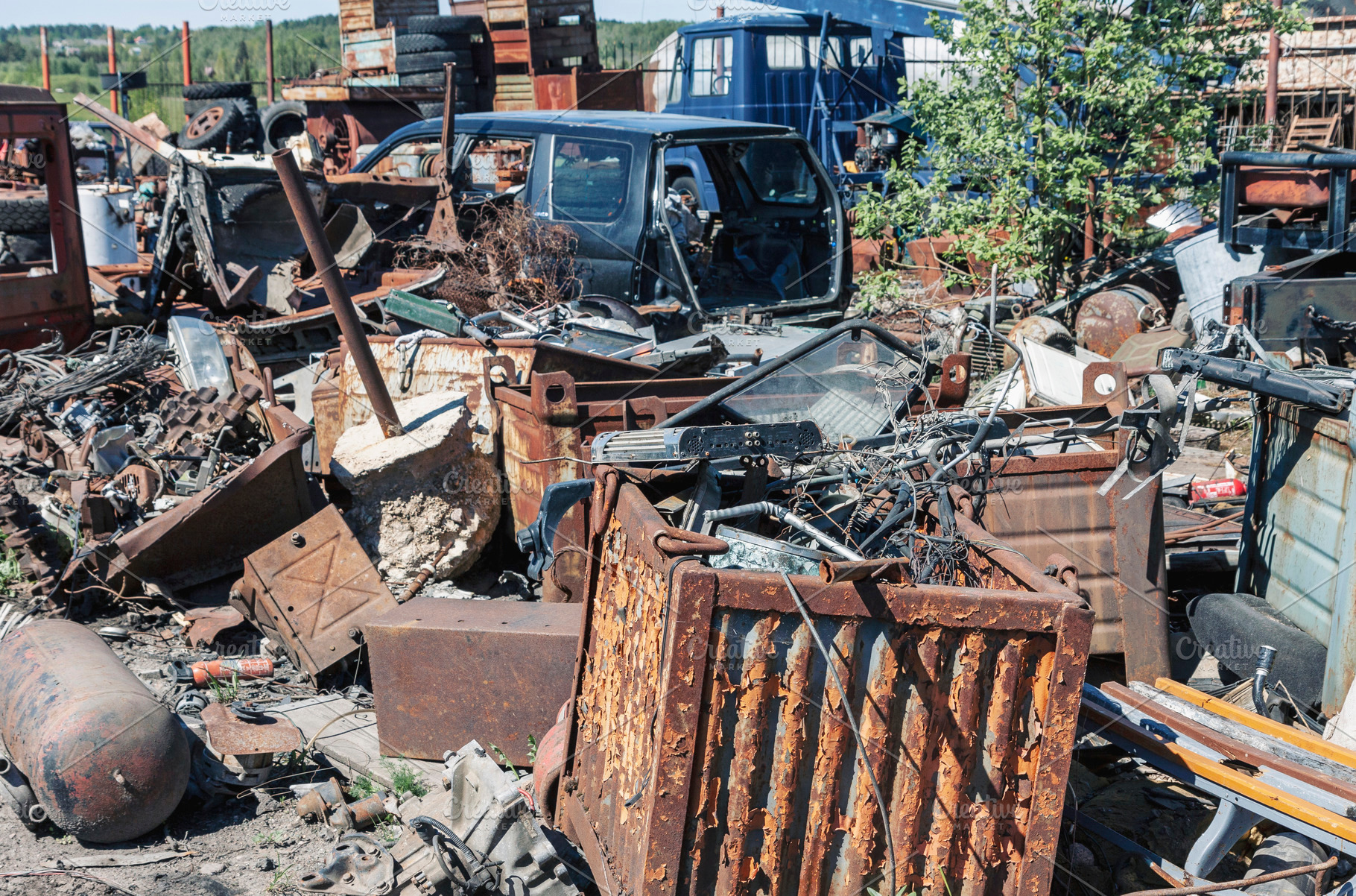 Rusty metal garbage on junkyard, an Industrial Photo by BOOCYS