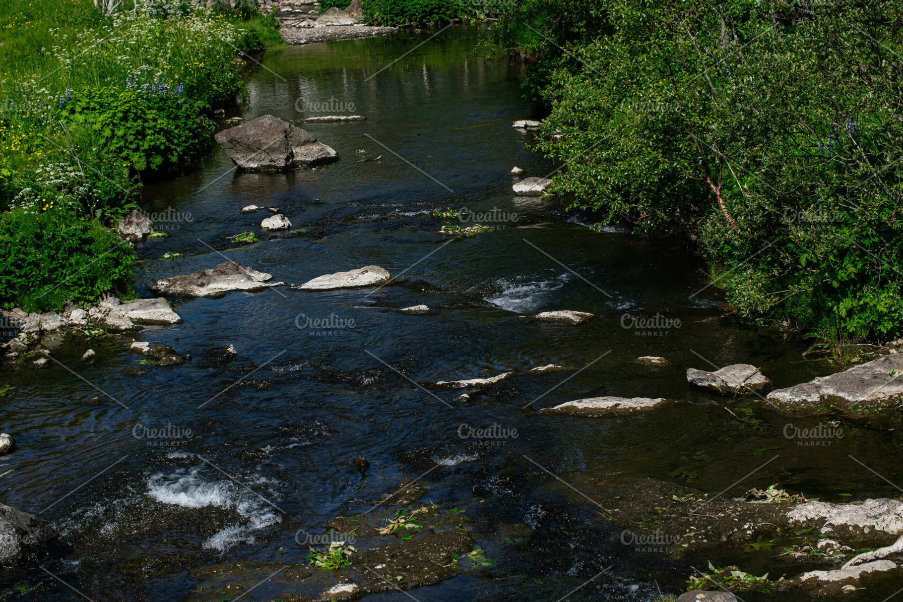 Scenic river landscape with rocks and vegetation in Mosfellsbær, Iceland, duri, a Photo by AS photostudio