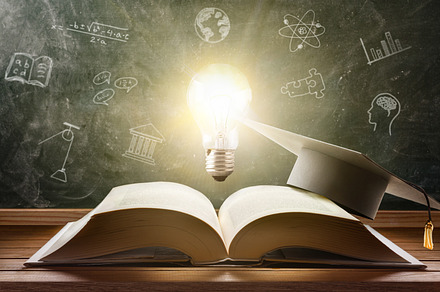 Concept of study in education with book an illuminated lightbulb
