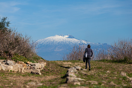 A tourist watch the Etna volcano, an Architecture Photo by Bepslabor