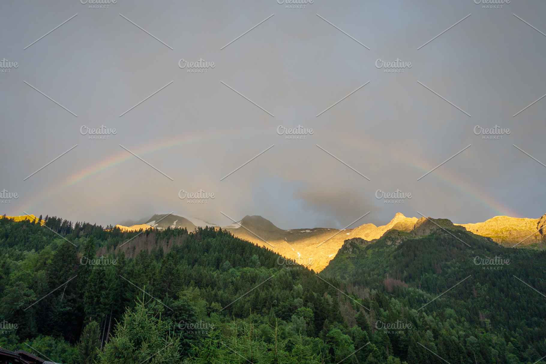 Rainbow over mountain forest at Contamines Montjoie, France, a Nature Photo by GoodGoods
