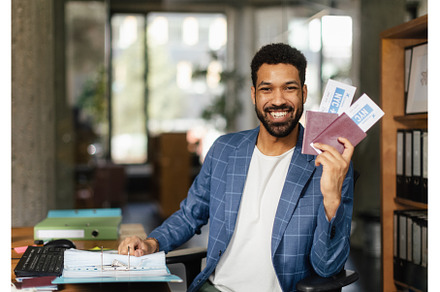 Young happy man holding plane, a Person Photo by HalfPoint