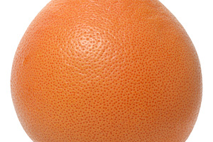 Whole pink grapefruit with textured peel, close-up on isolated b, a Food & Drink Photo by ndanko