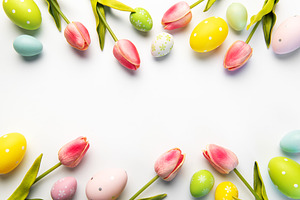 Easter eggs and tulips creating spring holiday frame, a Holiday Photo by Olena Rudo