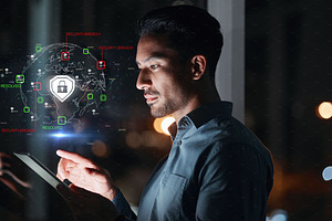 Cyber security, hacker man and tablet with hologram and safety lock icon for network, information or data. Person with technology for privacy, antivirus or hacking and access control shield at night, a Photo by Peopleimages.com