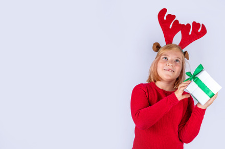 Christmas holiday background with funny girl, a Holiday Photo by Rimma
