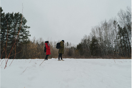Two individuals dressed warmly in