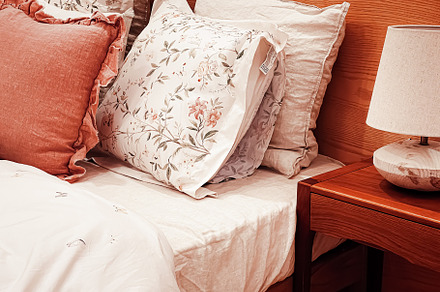 Vintage countryside style bedding with floral pattern on wooden, an Architecture Photo by Anneleven
