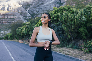 Cheerful female with smartwatch, a Sports & Recreation Photo by Artem Varnitsin