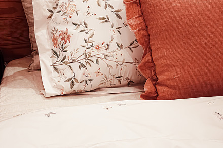 Vintage countryside style bedding with floral pattern on wooden, an Architecture Photo by Anneleven