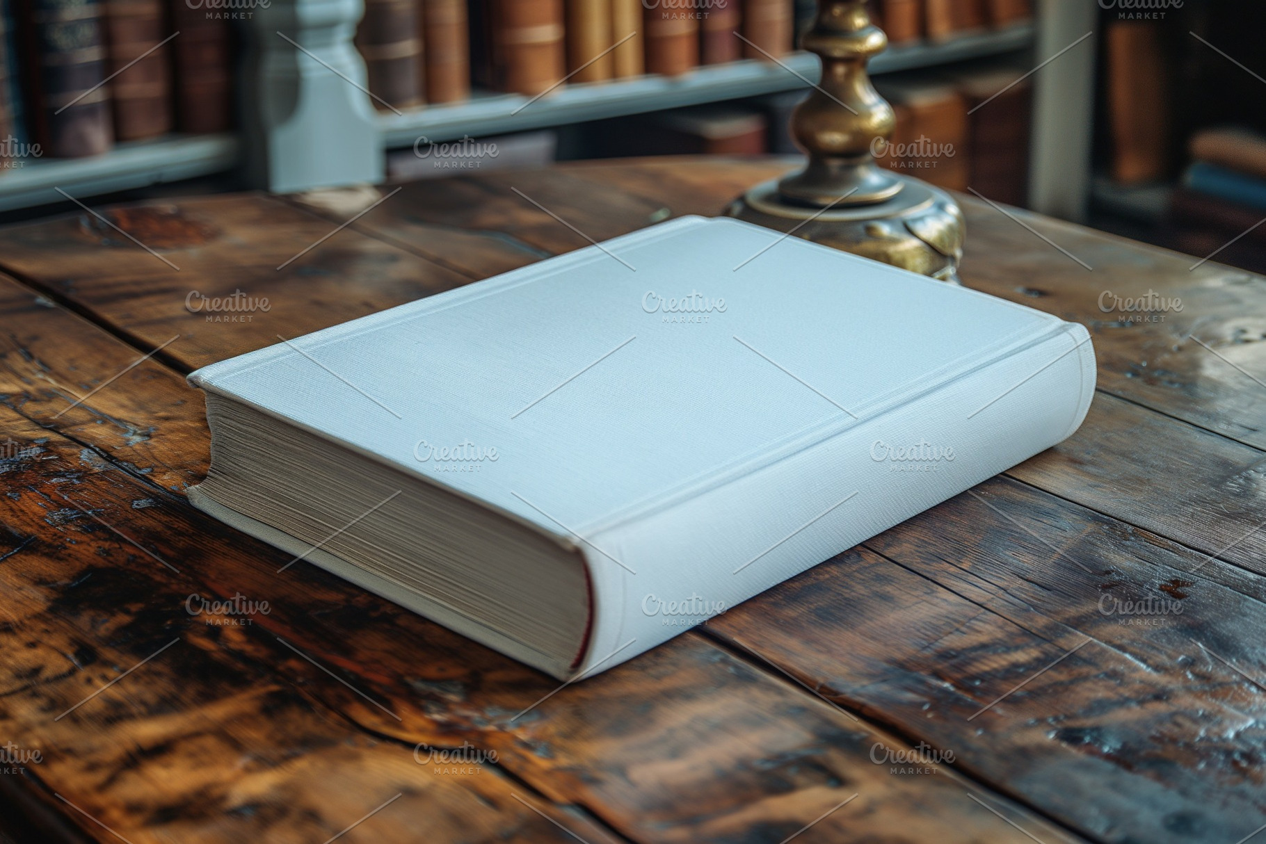 A pristine white book resting on a rustic wooden table in a cozy library settin, a Business Photo by ImageMir