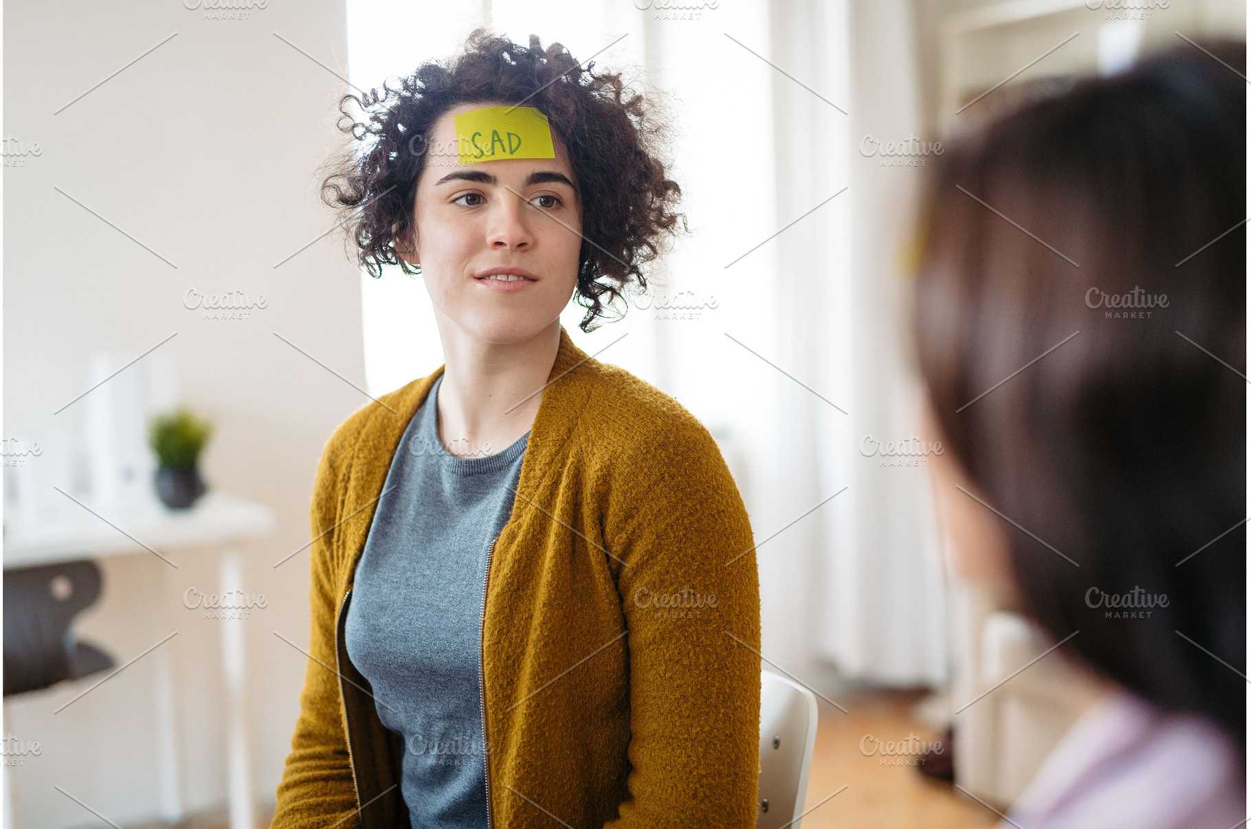 Woman writing her problem on sticky, a Business Photo by HalfPoint