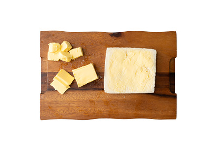 Butter on a slice of bread isolated on white background on a pla, a Food & Drink Photo by Tampatra