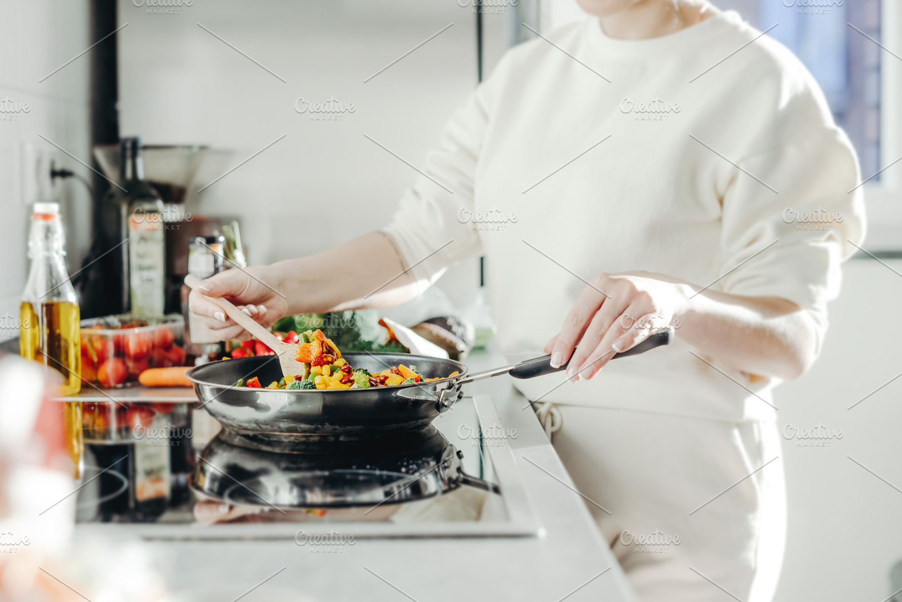 Woman cooking vegetables on pan, a Food & Drink Photo by Valeria Art