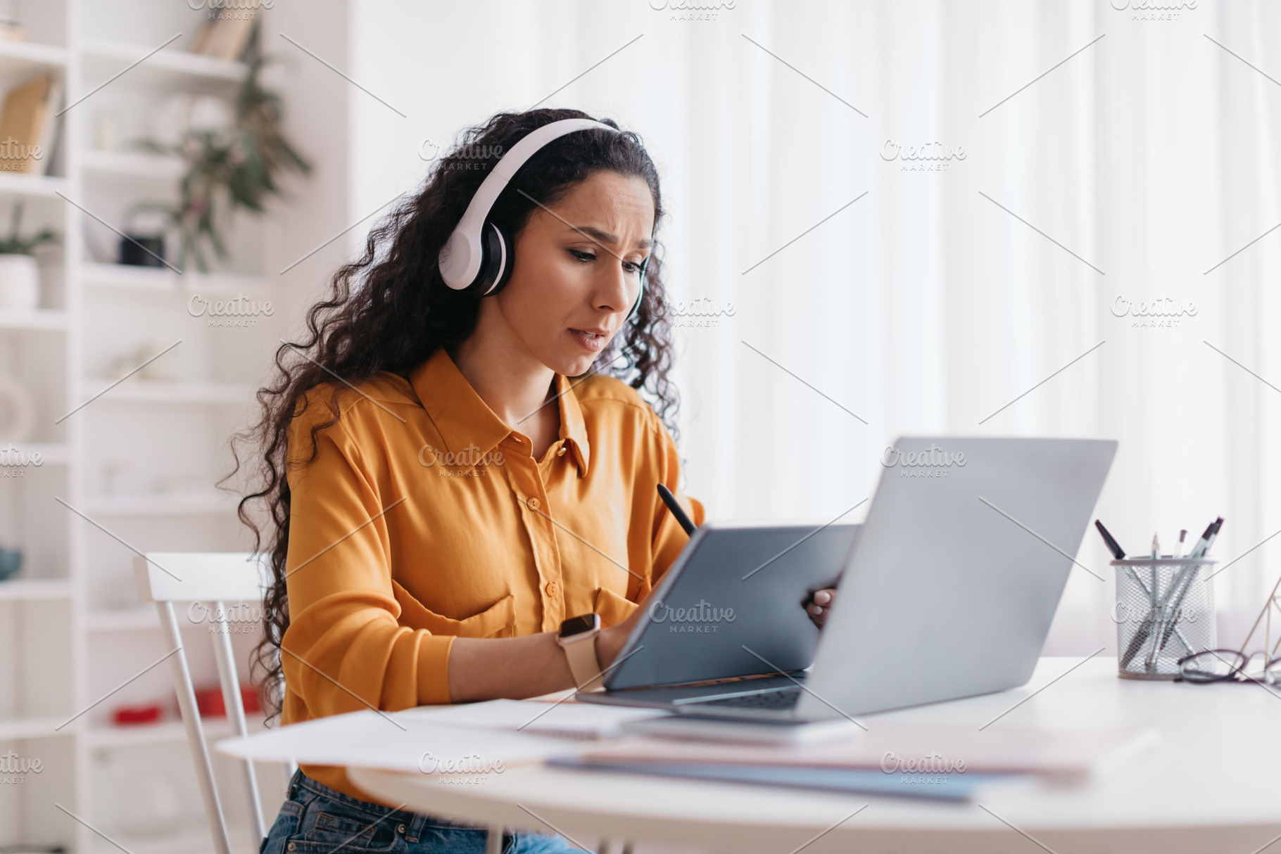 Lady Using Tablet And Laptop, Drawing With Stylus In Office, a Photo by Prostock-Studio