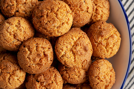 Homemade Sweet and Crunchy Amaretti on a Plate, top view. Flat l, a Food & Drink Photo by LiudmylaChuhunova